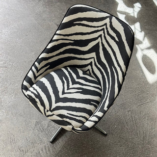 Vintage swivel armchair upholstered in black zebra